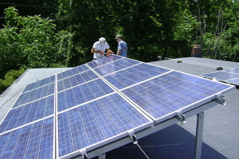 Installation of a rooftop photovoltaic array near Poughkeepsie, New York.
