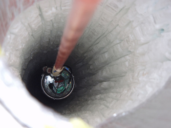 A sensor string being deployed for IceCube.