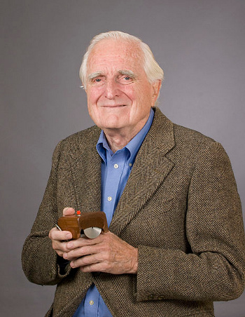 Douglas C. Engelbart with the first computer mouse prototype, 2008