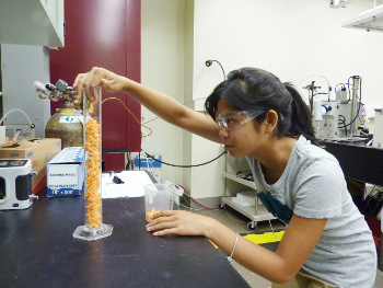 Jessica Young, and intern at NIST, doing a packing experiment