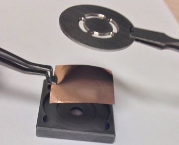 Loading copper foil into CVD fixture.