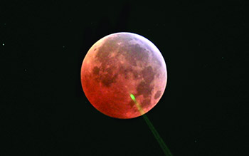 Laser ranging at a lunar eclipse