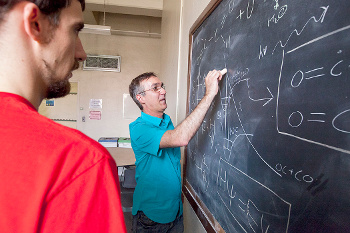 Prof. Andrei Sanov of the University of Arizona at blackboard